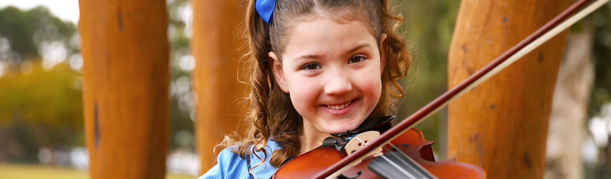 Student playing a violin
